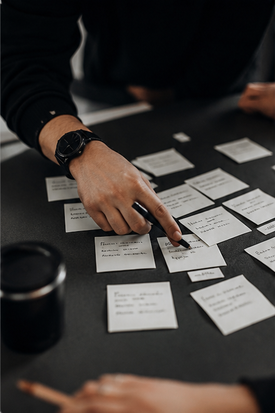 Mapping out priorities and action items on sticky notes during a clarity workshop
